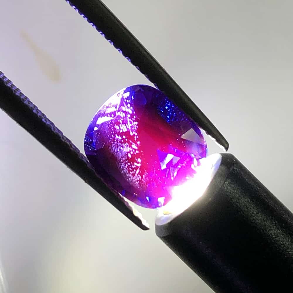 Clearly Visible is red fluorescence in Blue-Purple Tunduru Sapphire